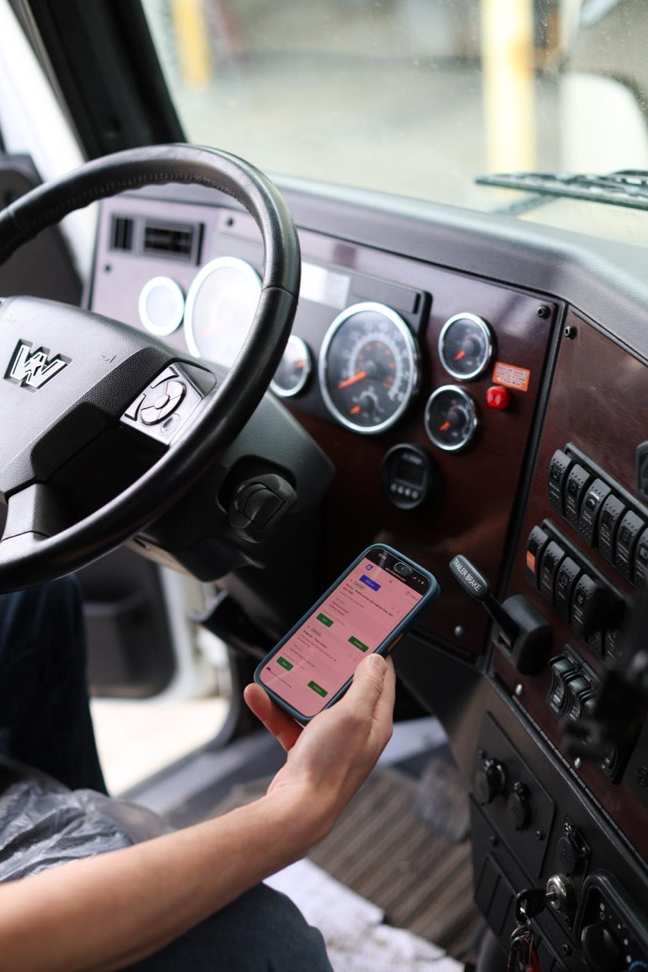 ShopView workflow displayed on a phone inside a truck cab