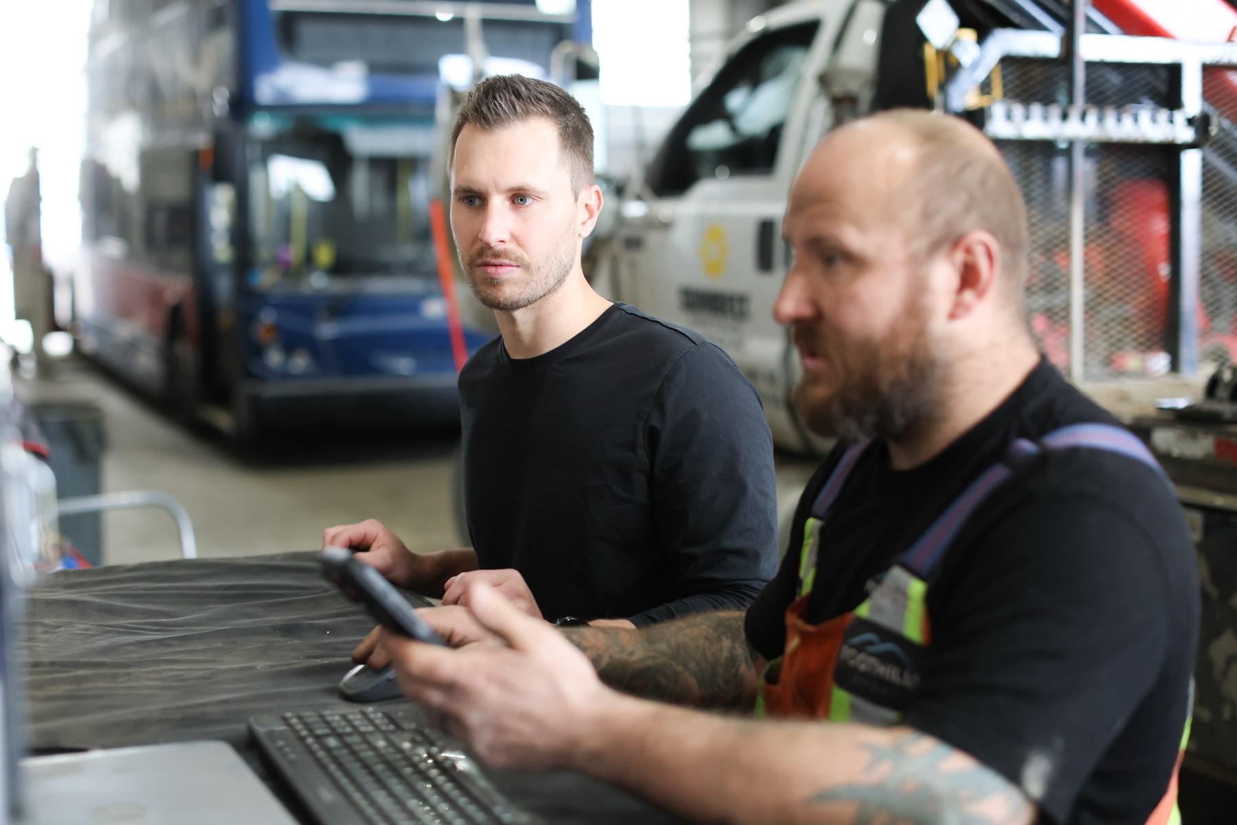 Fabian reviewing shop systems with a Foothills technician